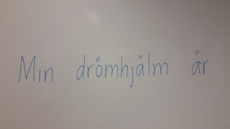 Text på whiteboard.