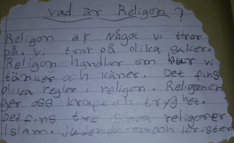 Handskriven text om religion.