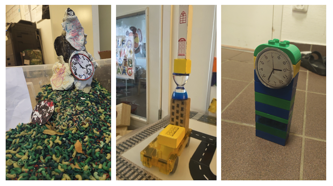 Ett fyrtorn med klocka och ett kyrktorn som förskolebarnen skapat med bland annat färglagda makaroner, byggklossar och legobitar.