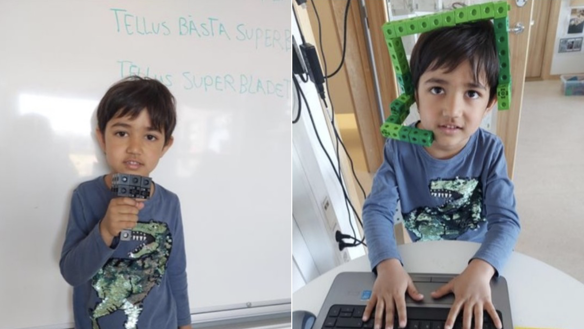 Ett barn på förskolan håller i en mikrofon och talar i ett headset som tillverkats av byggklossar.